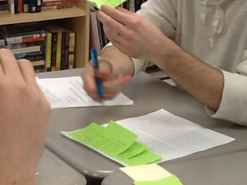 Student Reading his sticky notes